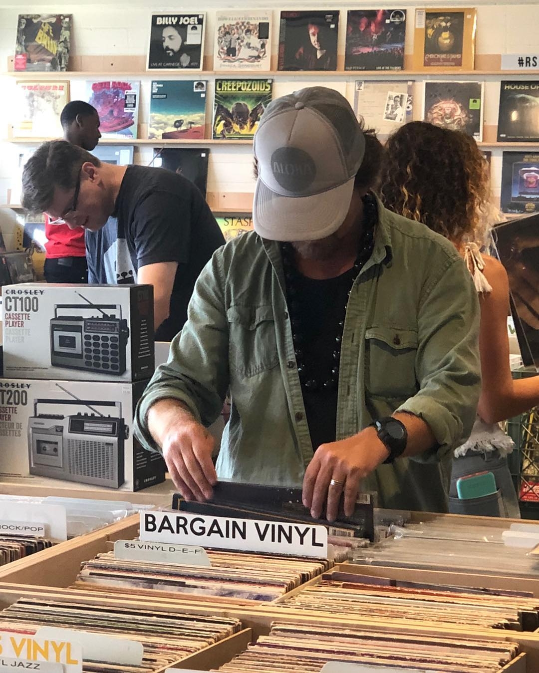 Eddie Vedder in Chicago visiting a music store and getting interviewed by a radio station